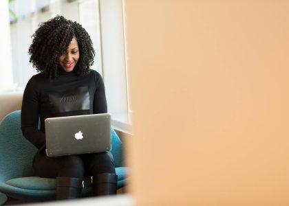 woman holding macbook